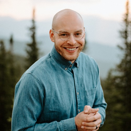 Profile Picture of Jordan White smiling in button up shirt.